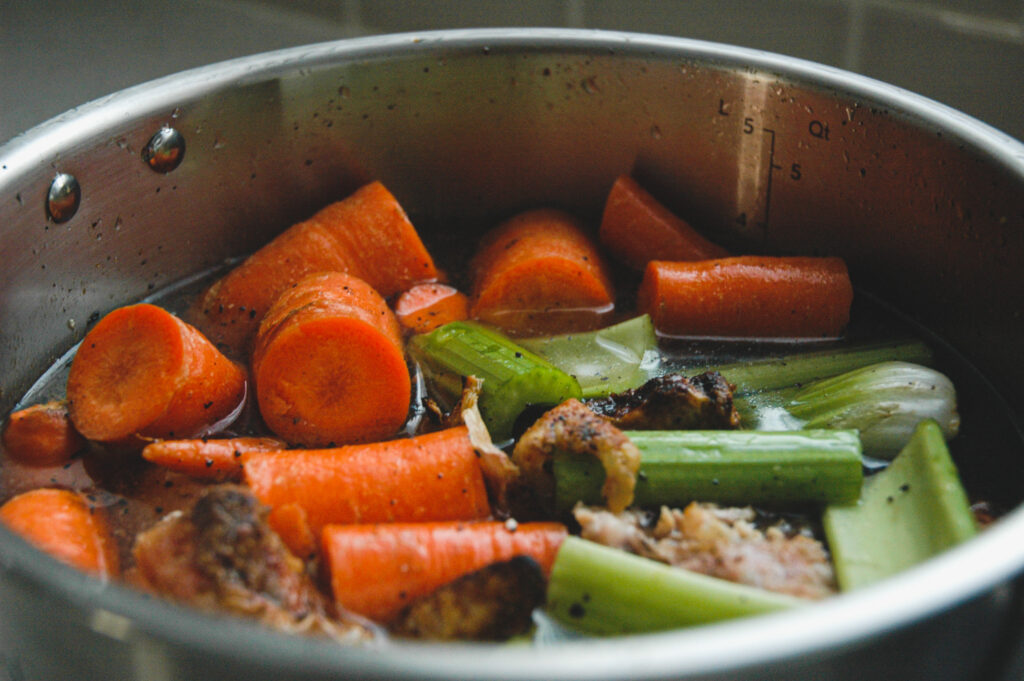 Add just enough water to cover the ingredients in the pressure cooker. 