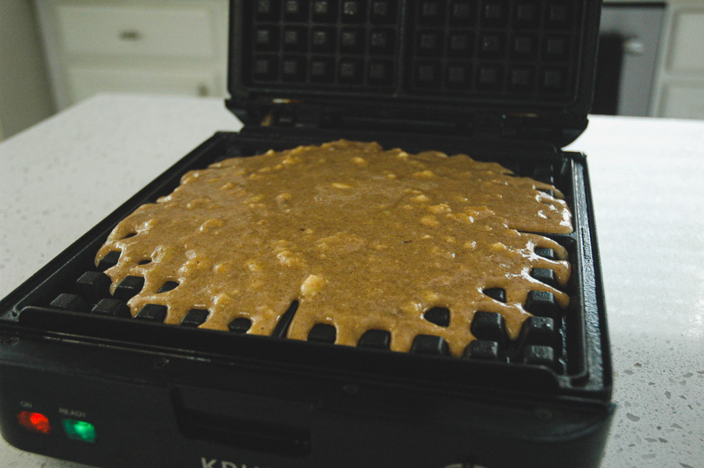 gluten free waffles batter poured into the waffle iron