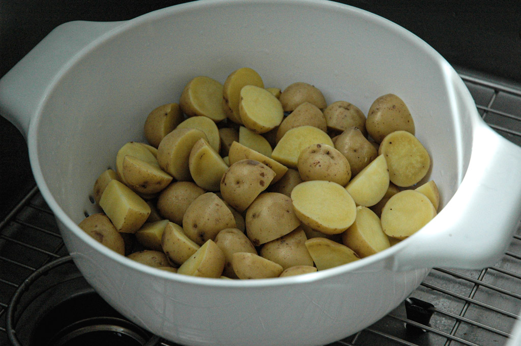 parboiled yellow potatoes drained and drying